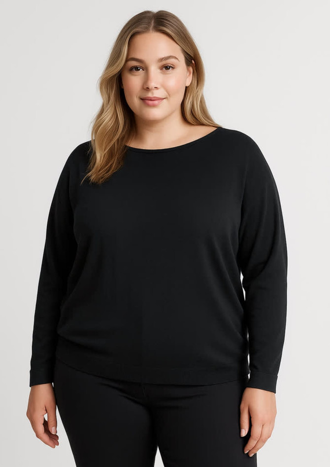 A black batwing sweater top with a round neckline and long sleeves. The model is wearing it with matching black pants.