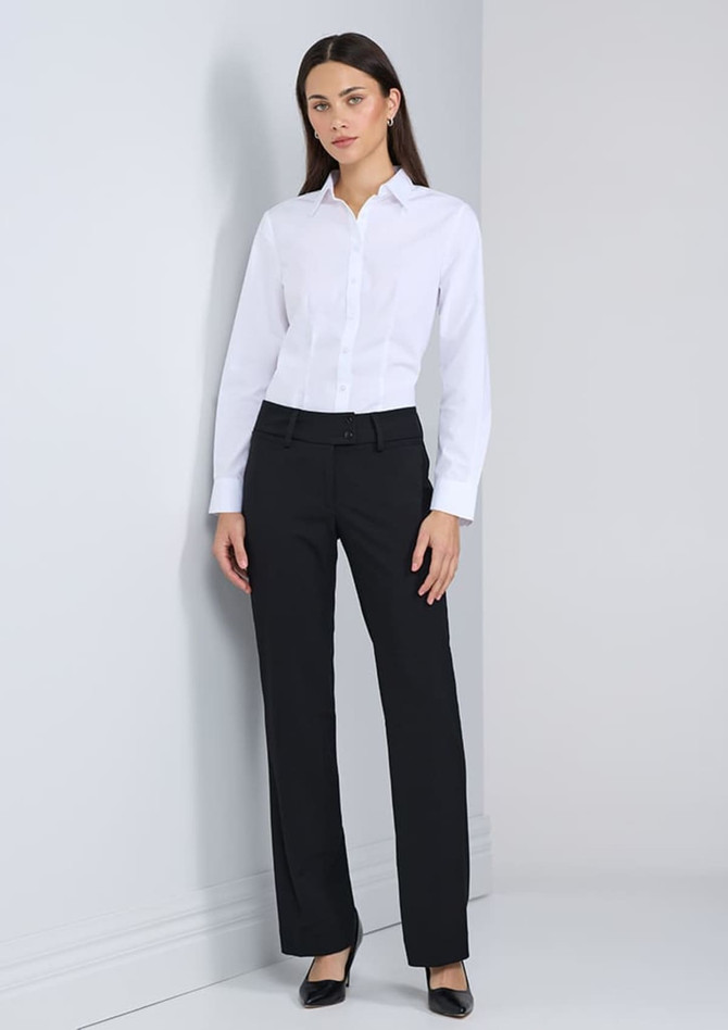 A long sleeve white shirt worn with black trousers, featuring a sleek design and a simple collar. It includes a logo.