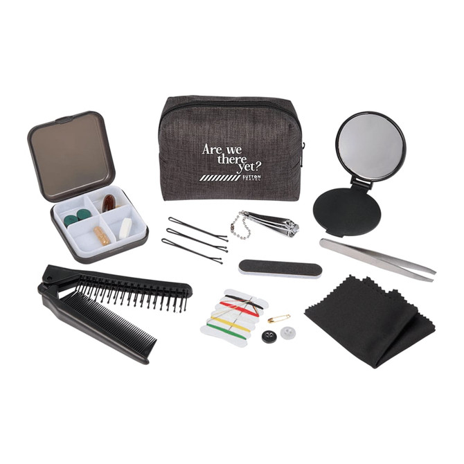 A grey travel pouch with a mirror, comb, tweezers, needles, thread, buttons, hair pins, and cloths.