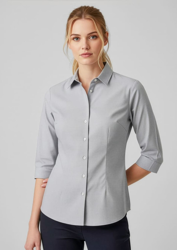 A grey women's button-up shirt with 3/4 sleeves and a fitted style, featuring a collar and a logo.