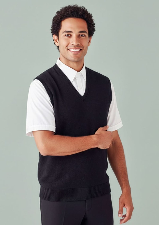 A man wearing a black Milano Mens Vest over a white shirt, featuring a v-neck design. The vest has a logo.