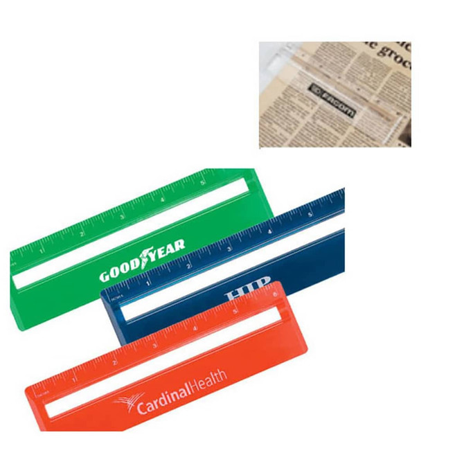 A set of three 15cm rulers in green, blue, and red with clear magnifying sections and logos.