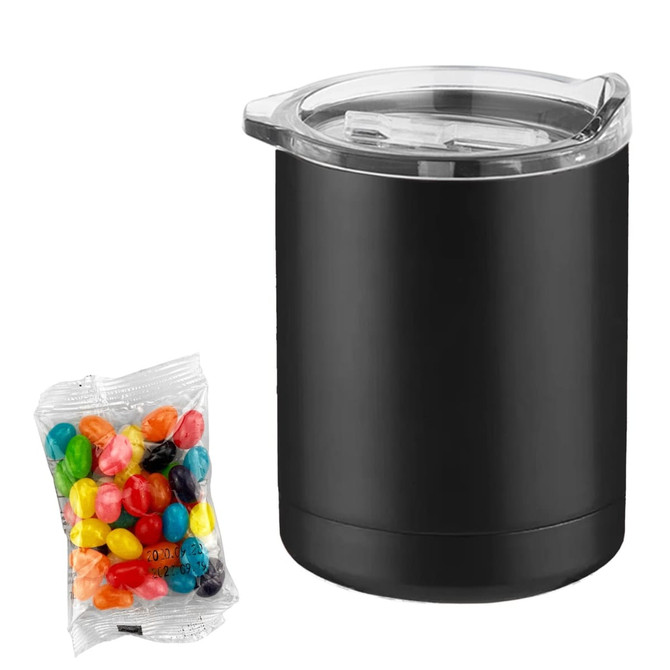 A black coffee mug with a transparent lid beside a pack of colourful jelly beans.