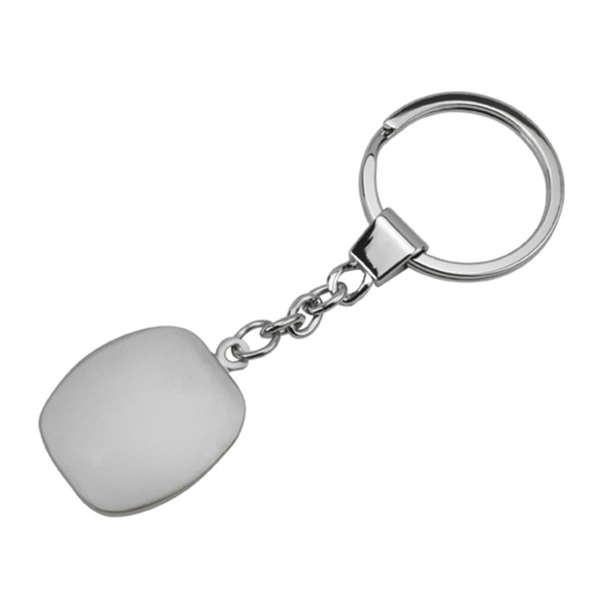 A metallic key ring with a smooth, white cubic pendant attached by a chain.