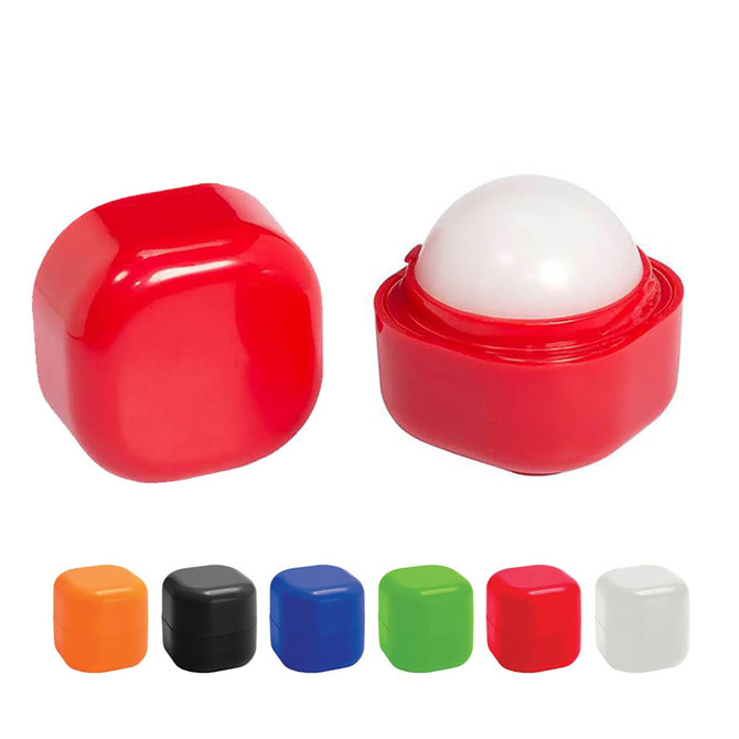 A red lip balm cube with a white applicator top, alongside other coloured cube options including orange, black, green, and blue.