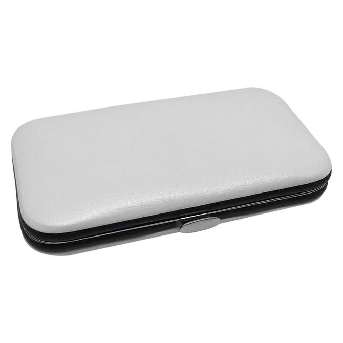 A white and black manicure set case featuring a smooth exterior and a silver clasp.