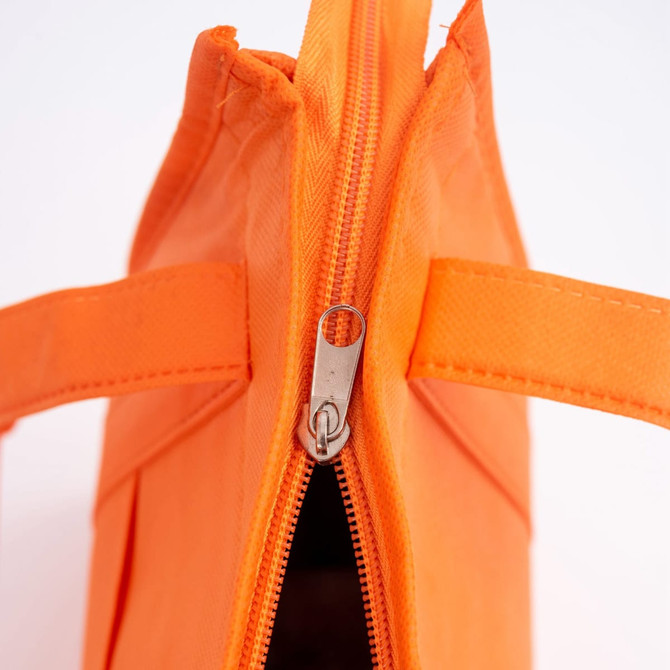 An orange non-woven cooler bag featuring a top zip closure and two sturdy handles. It has a branding logo.