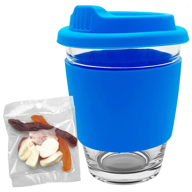 A reusable coffee cup with a blue silicone sleeve and lid, accompanied by a pack of jelly sweets.