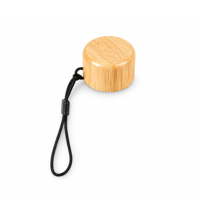 A drink bottle lid made of bamboo, featuring a sleek circular design with a black attachment cord.