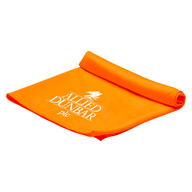 An orange cooling towel, neatly rolled, featuring a logo. Ideal for leisure and outdoor activities.