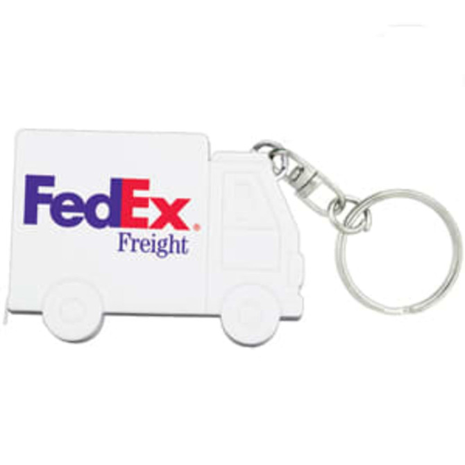 A keychain shaped like a white delivery truck, featuring a logo and a metal clasp for attachment.