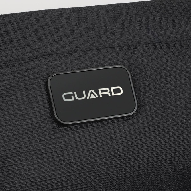 A black sling bag with a rectangular logo featuring the word "GUARD" prominently displayed.