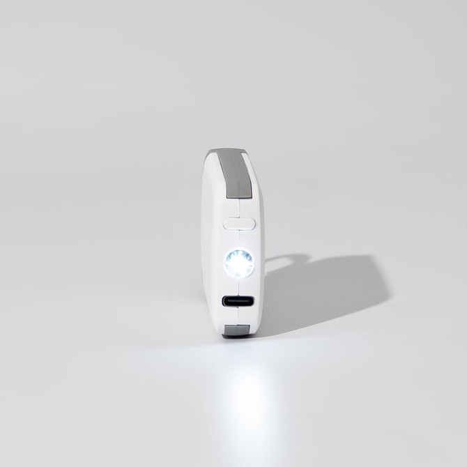 A white mini power bank with a grey accent and a built-in light, featuring a logo on the side.