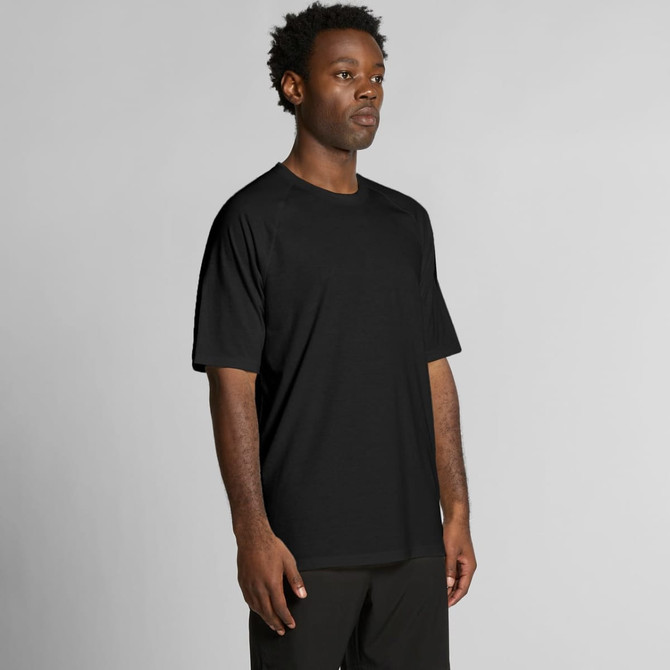 A black active blend T-shirt on a male model, featuring short sleeves and a relaxed fit. It has a logo on it.