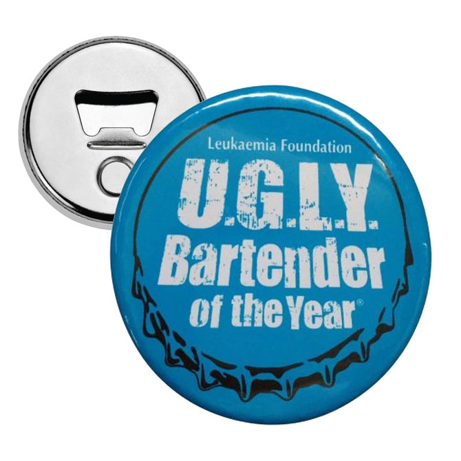 A drink bottle opener with a silver backing and a blue button badge on the front featuring text and a logo.