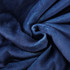 A textured, deep navy blue blanket made from 100% polyester, featuring a soft and luxurious appearance.