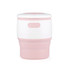 A drink bottle in pink and white, featuring a collapsible design, ideal for reusable coffee consumption.