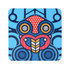 A square cork coaster featuring vibrant blue, red, and black patterns with a stylised design and a logo.