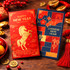 A red envelope featuring a gold unicorn design alongside a blue envelope with a festive pattern, both for Chinese New Year.