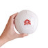A mini white soccer ball held in a hand, featuring a logo on one side.