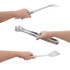 Three pieces of stainless steel barbecue tools held in hands, including a fork, spatula, and tongs, with a pouch present.