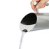 A stainless steel pitcher pouring water, featuring a sleek design and shiny finish, with a handle for easy gripping.