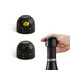 A drink bottle stopper in black, with two interchangeable tops and a hand holding one, featuring a logo.