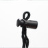 A black toggle and cord for securing items, featuring a rounded end and adjustable design.