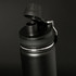 A drink bottle in matte black featuring a removable lid and spout. It has a metallic finish and a logo.