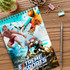 A medium full-colour notepad featuring extreme sports visuals, with a coil binding, placed on a wooden desk with stationery.