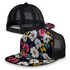 A floral-patterned flat peak mesh cap featuring a black mesh back and a vibrant design of white, pink, and yellow flowers.