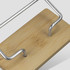 A bamboo business card stand with a metal frame featuring a clean, natural finish. The base is made of light-coloured bamboo.