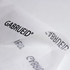 Kraft paper in white featuring a repeating black logo design, folded to display its texture and branding.