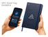 A navy blue notepad with an NFC tag feature next to a smartphone displaying a detected tag notification.