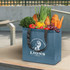 A blue tote bag with black handles filled with fresh produce including vegetables and fruits, featuring a logo.