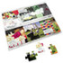 A4 cardboard jigsaw featuring colourful puzzle pieces and an illustrated background. Includes a logo.