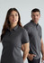 A grey short sleeve polo shirt for men, featuring a collar and a logo. Two models are wearing the polo.