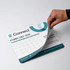A mouse mat in light blue and white, featuring a calendar for February 2025 and a logo. A mouse mat in light blue and white, featuring a calendar for February 2025 and a logo.