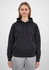 A women's hoodie in black with a drawstring hood and a front pocket, worn with grey pants.
