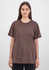 A brown short sleeve women's tee displayed on a model, featuring a simple design and relaxed fit.