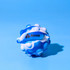 A blue and white stress ball resembling a popper, featuring a logo.