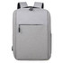 A grey backpack with two shoulder straps and a front pocket, featuring a minimalist design and logo.