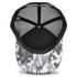 A black and white snow camo trucker cap with a mesh back and a solid black interior. It features a logo on the side.