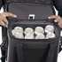 A black cooler bag held open, revealing several silver drink cans neatly arranged inside.