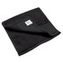 A black fitness towel, featuring a folded corner and a small branded label on its edge.