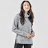 A grey women's cowl neck pullover features a relaxed fit and side slits, accompanied by a subtle logo.
