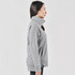 A grey women's pullover with a cowl neck and a logo, featured in a side profile view.