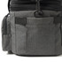 A grey expanding cooler with multiple pockets and zippers, featuring a sleek design and a black trim.