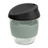 A drink bottle featuring a clear borosilicate body with a black lid and a soft green silicone sleeve.