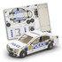 A model car in white with blue and yellow police markings, alongside its cardboard assembly sheet.